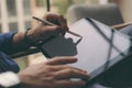 Close-up view of businessman using stylus pen for working at office on digital tablet screen.Blurred background Royalty Free Stock Photo