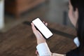 Close up view of businesswoman holding mobile phone with blank screen. Royalty Free Stock Photo