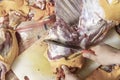 Close up view of butcher chopping a raw Lamb and mutton using a sharp knife on a wooden cutting board at the kitchen. Selective fo