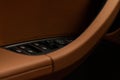 Close up view of button controlling window in modern car interior. Royalty Free Stock Photo