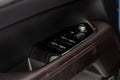 Close up view of button controlling window in modern car interior. Royalty Free Stock Photo