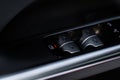 Close up view of button controlling window in modern car interior. Royalty Free Stock Photo