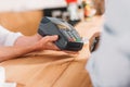 close up view of cafe worker holding card key reader Royalty Free Stock Photo