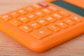 The close-up view of the calculator underscores its relevance to the fields of business and the economy