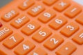 The close-up view of the calculator underscores its relevance to the fields of business and the economy