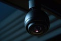 A close up view of a camera mounted on a ceiling. This image can be used to depict surveillance, security systems, or Royalty Free Stock Photo