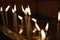 Close up view of the candles burning brightly in the dark Royalty Free Stock Photo