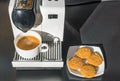 Close up view of capsule coffee machine with brewed cup of coffee.