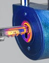Glowing Key Unlocking a High-Tech Padlock Royalty Free Stock Photo