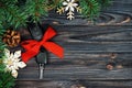 Close-up view of car keys with red bow as present on wooden vintage background Royalty Free Stock Photo