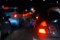 close-up view of car tail light and right turn signal at night traffic jam Royalty Free Stock Photo