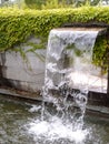 Close-up view of a cascading feature water fountain in a public park. Royalty Free Stock Photo