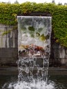 Close-up view of a cascading feature water fountain in a public park. Royalty Free Stock Photo