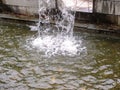 Close-up view of a cascading feature water fountain in a public park. Royalty Free Stock Photo