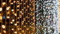 A close-up view of cascading string lights in warm yellow and cool white, creating a festive bokeh effect against a dark Royalty Free Stock Photo