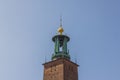 Close-up view of cathedral dome with bells on blue sky background.