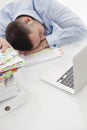 Close-up view of Caucasian businessman asleep at his desk