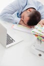 Close-up view of Caucasian businessman asleep at his desk