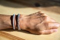 Close up view of a caucasian woman hand and forearm withvtraditional silver and leather Sami bracelets Royalty Free Stock Photo