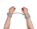 Close up view of chained man's hands