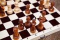 Close up view chess pieces on wooden board