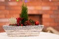 A close-up view of a Christmas Day reed against the backdrop of a fuzzy fireplace Royalty Free Stock Photo