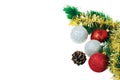 Close up view of Christmas fir tree branch with  cone and colorful balls isolated on white background.  Postcard. Royalty Free Stock Photo