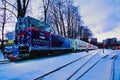 Close-up view of Christmas illuminated train. Train arrived at the station. Holiday decorations of train