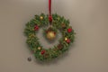 Close up view of Christmas wreath of spruce branches hanging on apartment front door. Royalty Free Stock Photo