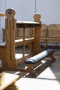 A close up view of a church bench lit by a sunrays Royalty Free Stock Photo