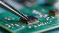 Modern Circuit Board Technology with Precision Tweezers in Royalty Free Stock Photo