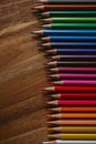 Close up view of colored pencils on wooden background. Back to school and education concept. u Royalty Free Stock Photo