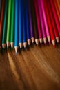 Close up view of colored pencils on wooden background. Back to school and education concept. u Royalty Free Stock Photo