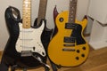 Close up view of colorful guitars on white background.