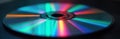 Close-up view of colorful prismatic reflection on silver compact disc. Vibrant spectrum of light refracted through disc surface. Royalty Free Stock Photo