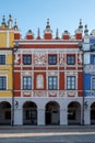 Close up view of colourful renaissance buildings in the historic Great Market Square in Zamosc in southeast Poland.