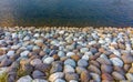 Close-up view of stones of various sizes forming the bank of the Saigawa river which passes through the