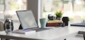 Close-up view of comfortable designer workplace with blank screen tablet and office supplies Royalty Free Stock Photo