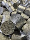 Close up view of compressed aluminium turnings called briquettes or pucks. Royalty Free Stock Photo