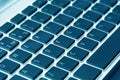 Close up view of a computer keyboard keys in blue tones Royalty Free Stock Photo