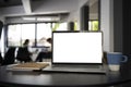 Computer laptop with blank screen, coffee cup and notebook on black office desk. Royalty Free Stock Photo