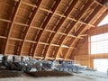Close-up view of the connection of metal and wooden beams. Steel roof frame under construction. The interior of a big industrial Royalty Free Stock Photo