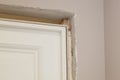 close up view of the corner of the installed door with the opening filled with mounting foam