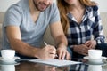 Tenants write signature on rental sale agreement, close up view Royalty Free Stock Photo