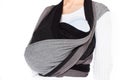 Close up view on craddle position in front cross carry wrap in woven wrap baby carrier Royalty Free Stock Photo