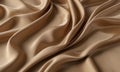 close-up view crumpled beige satin fabric, with slight curl and smooth surface.