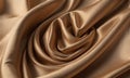 close-up view crumpled, shiny gold-colored fabric, with subtle texture and slight curl.