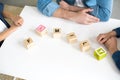 close-up view of cubes with word family and hands of father