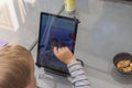 Close-up view of cute child playing on tablet. Sweden.