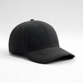 A single black baseball cap displayed against a plain light gray background Royalty Free Stock Photo